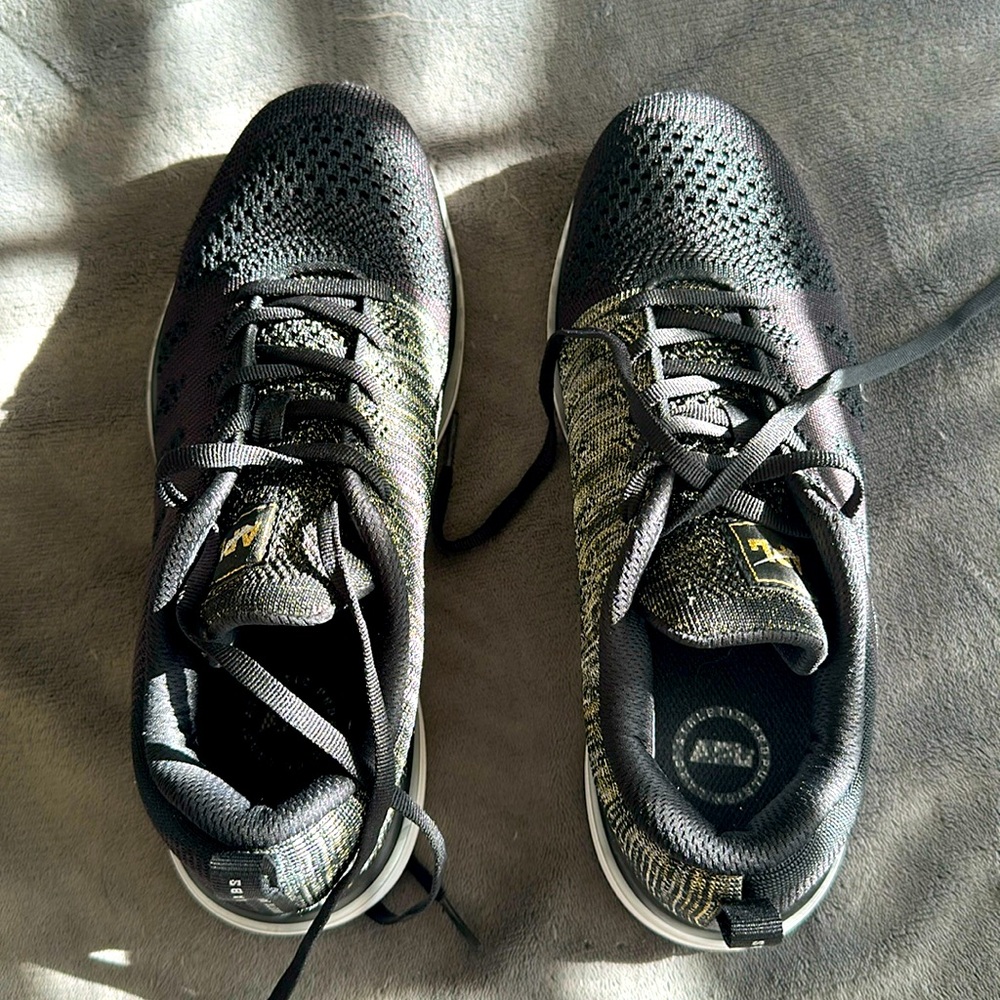 Fairly brand new APL sneakers size 9 1/2 worn once wants black and gold